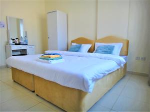 Abu Hail Star Residence - Home Stay客房内的一张或多张床位