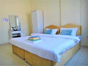 Abu Hail Star Residence - Home Stay客房内的一张或多张床位