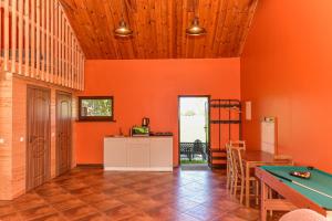 a dining room with a pool table in it at Spacious Loft in the Nature in Molėtai