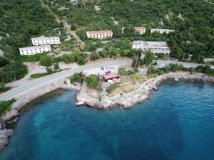 an aerial view of a resort next to the water at Delfin Apartments in Sveti Juraj