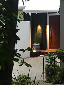 a front door of a house with a potted plant at Pengelly's Boutique Private Residence in Buderim