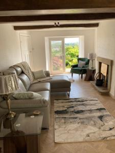Prostor za sedenje u objektu Lazy Days Cottage
