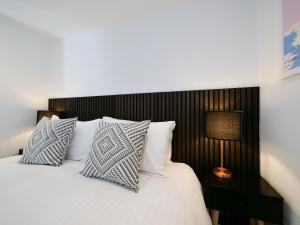 Ένα ή περισσότερα κρεβάτια σε δωμάτιο στο Kingsbridge Penthouse