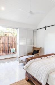 a bedroom with two beds and a balcony at Pengelly's Boutique Private Residence in Buderim