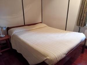 Postel nebo postele na pokoji v ubytování Kiloran House