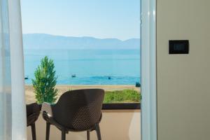 a balcony with a view of the ocean at Kraal Hotel Vlore in Vlorë