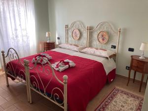 A bed or beds in a room at La terrazza fio...Rita