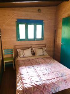 A bed or beds in a room at CABANA DO SOL