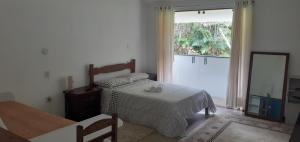 Postel nebo postele na pokoji v ubytování Canto do Riacho Suites