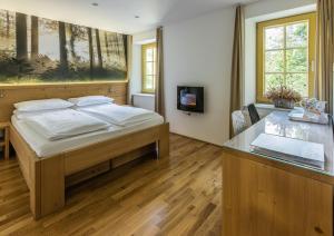 Postel nebo postele na pokoji v ubytování Boutique rooms Pri Rogovilcu