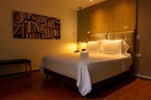 Postel nebo postele na pokoji v ubytování Quo Quality Hotel