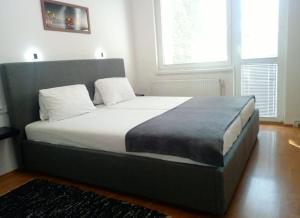Posteľ alebo postele v izbe v ubytovaní Repose Apartments