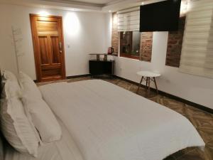 Cama o camas de una habitación en Hostal & Spa Casa Real