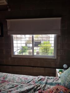 Postel nebo postele na pokoji v ubytování Casa con pileta LA PLATA + 17 fotografií