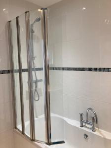 a bathroom with a shower and a sink at Henley Town Rooms in Henley on Thames +26 photos