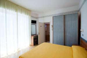 Postel nebo postele na pokoji v ubytování Albergo Villa Mauri