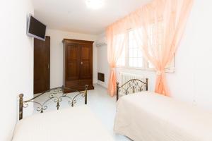 Postel nebo postele na pokoji v ubytování B&B La Casa nel Borgo
