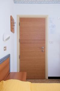Postel nebo postele na pokoji v ubytování Albergo Villa Mauri