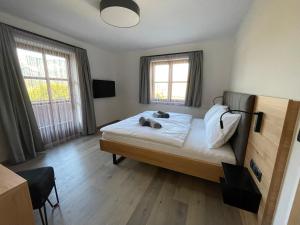 Postel nebo postele na pokoji v ubytování HAUSZEIT APPARTEMENTS