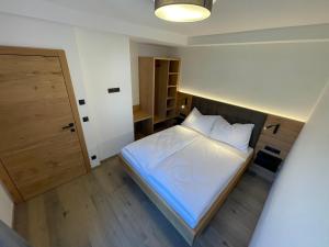 Postel nebo postele na pokoji v ubytování HAUSZEIT APPARTEMENTS