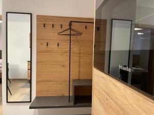 a shower in a room with a glass wall at HAUSZEIT APPARTEMENTS in Haus im Ennstal