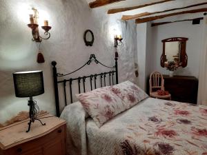 Ένα ή περισσότερα κρεβάτια σε δωμάτιο στο La casa del Herrero
