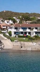 a large house on the shore of a body of water at Villa Pula Mare in Pula