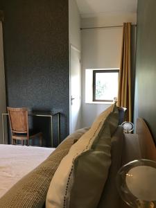 Postel nebo postele na pokoji v ubytování Chambres d hôtes La clé des arches