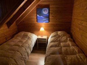 Giường trong phòng chung tại Casa Lago Hermoso