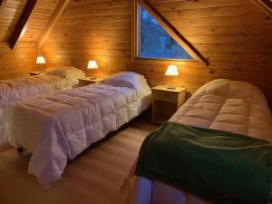 Voodi või voodid majutusasutuse Casa Lago Hermoso toas