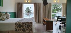 Cama ou camas em um quarto em Juquei Frente ao Mar Hotel Pousada mais 37 fotos