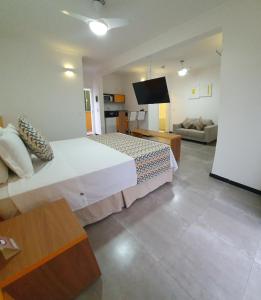 Cama ou camas em um quarto em Juquei Frente ao Mar Hotel Pousada