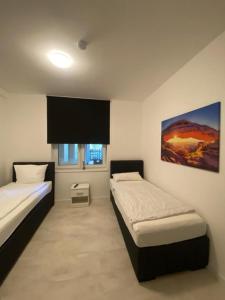Ein Bett oder Betten in einem Zimmer der Unterkunft City Apartments