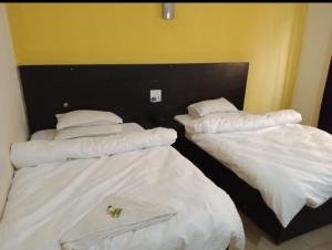Säng eller sängar i ett rum på Hotel Joshi