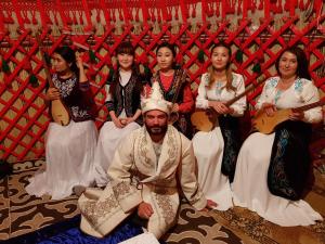 a group of people posing for a picture with a man in a crown at Apple Hostel Bishkek in Bishkek +104 photos