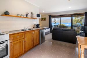 a kitchen with a sink and a counter top at Driftwood Cottages, Waterfront Studios in Dover