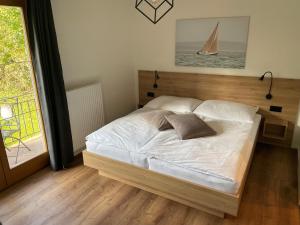Łóżko lub łóżka w pokoju w obiekcie Seaways Apartments