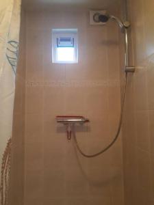 a shower in a bathroom with a window at Huize Visser in Egmond aan Zee +22 photos
