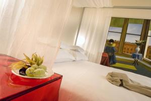 Postel nebo postele na pokoji v ubytování Petronilla - Hotel In Bergamo