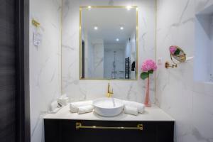 a bathroom with a sink and a mirror at House Klasika - Adults Only in Bled