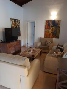 a living room with a couch and a coffee table at Villa Coral in Corralejo