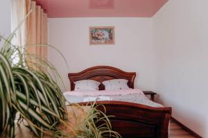 מיטה או מיטות בחדר ב-Family House Volosianka