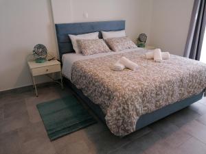 Postel nebo postele na pokoji v ubytování Amphitrite Apartments Skyros