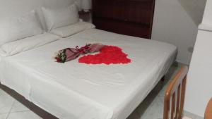 מיטה או מיטות בחדר ב-Al Vicolo