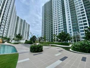 a courtyard in a large city with tall buildings at JB Perling New Cozy Studio in Johor Bahru