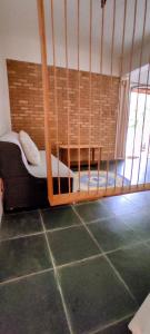 a room with a bunk bed in a room at O Caramuru Hostel - Cumuruxatiba in Cumuruxatiba