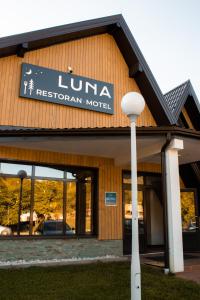 a building with a sign that reads luna regional motel at Odmorište Luna in Olovo