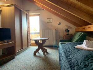 Кровать или кровати в номере Gasthof Sonnenheim