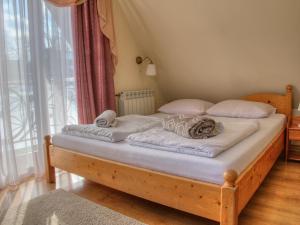 Llit o llits en una habitació de Willa Knieja