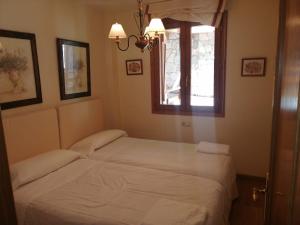 Postel nebo postele na pokoji v ubytování Apartamento Sarrato IV de Sallent